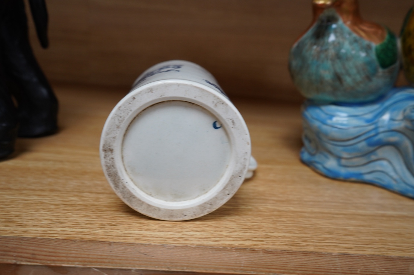 A Worcester blue and white porcelain mug, c.1775, 11.5cm high. Condition - fair to good.